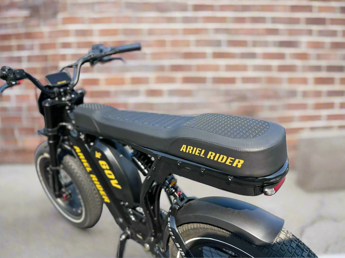 Black electric bike with 'Amel Rider' branding on a blurred background