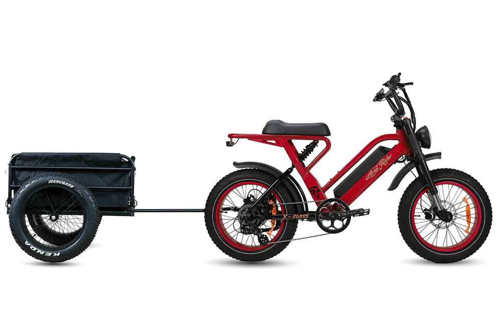 Ariel Rider X-Class 52V in black and gold towing the cargo trailer, side profile.