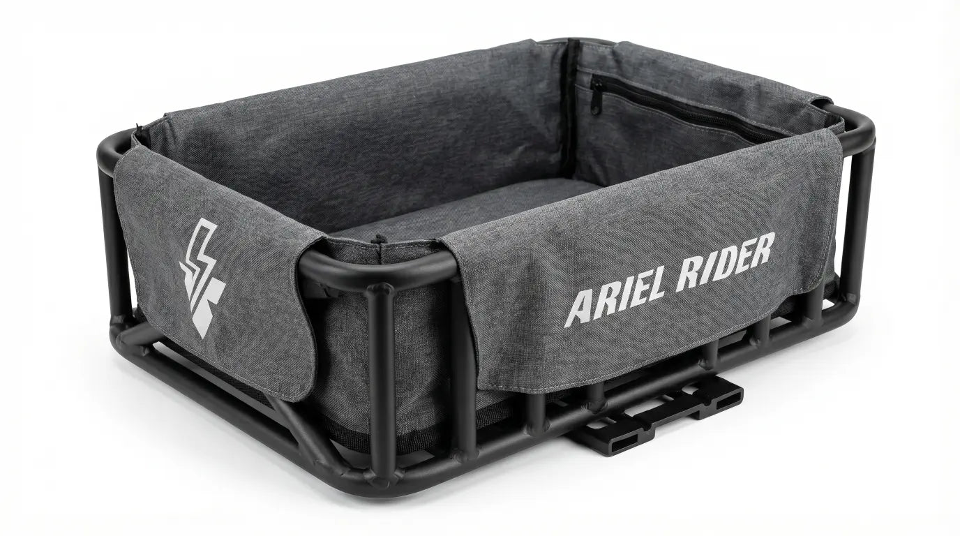 Angled side view of gray Cargo Basket Liner with Ariel Rider logo and side emblem