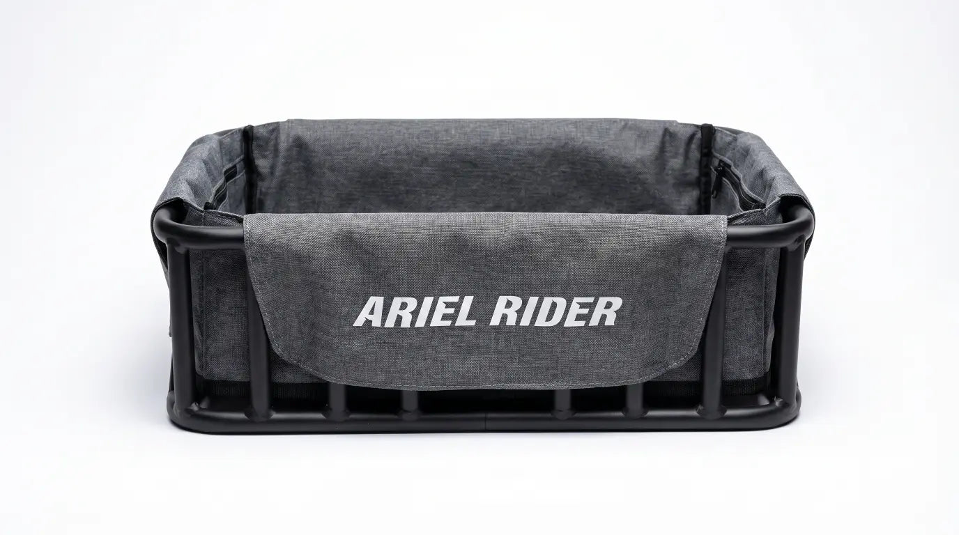 Product front view of fitted gray Cargo Basket Liner with Ariel Rider branding