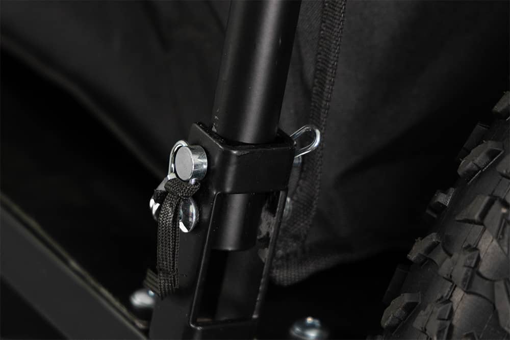 Close-up of quick-disconnect hitch mechanism on Ariel Rider cargo trailer.