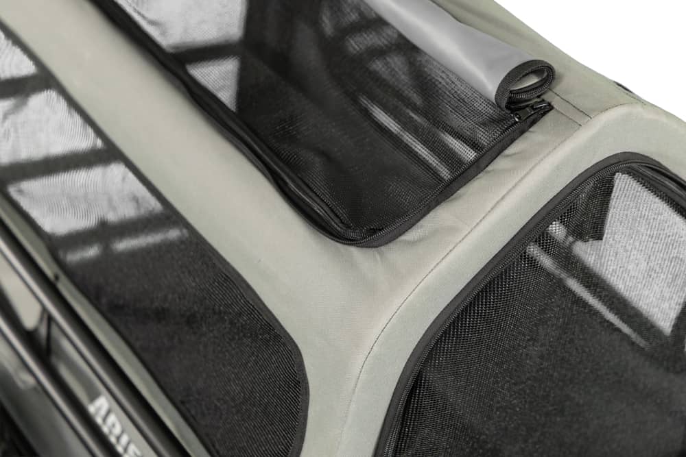 Close-up of mesh ventilation window on Ariel Rider dog carrier trailer canopy.