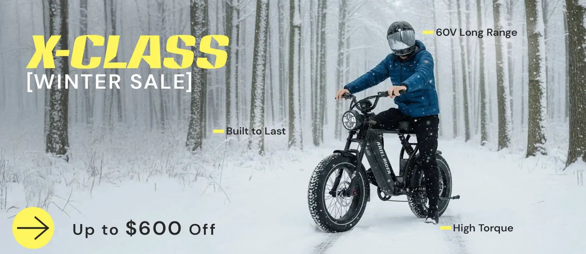 Ariel Rider X-Class 60V electric bike ridden through snowy forest, promoting winter sale and up to $600 off.