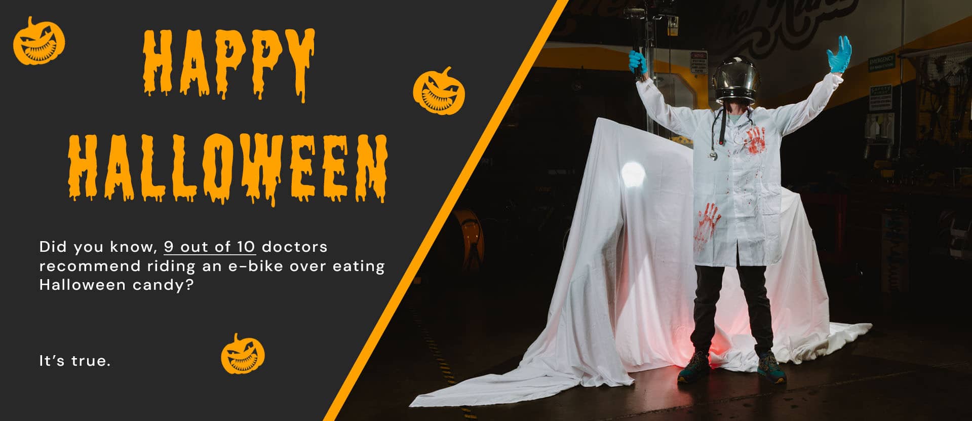 Halloween doctor-themed scene in Ariel Rider workshop with text saying Happy Halloween — 9 out of 10 doctors recommend riding an e-bike over eating candy.