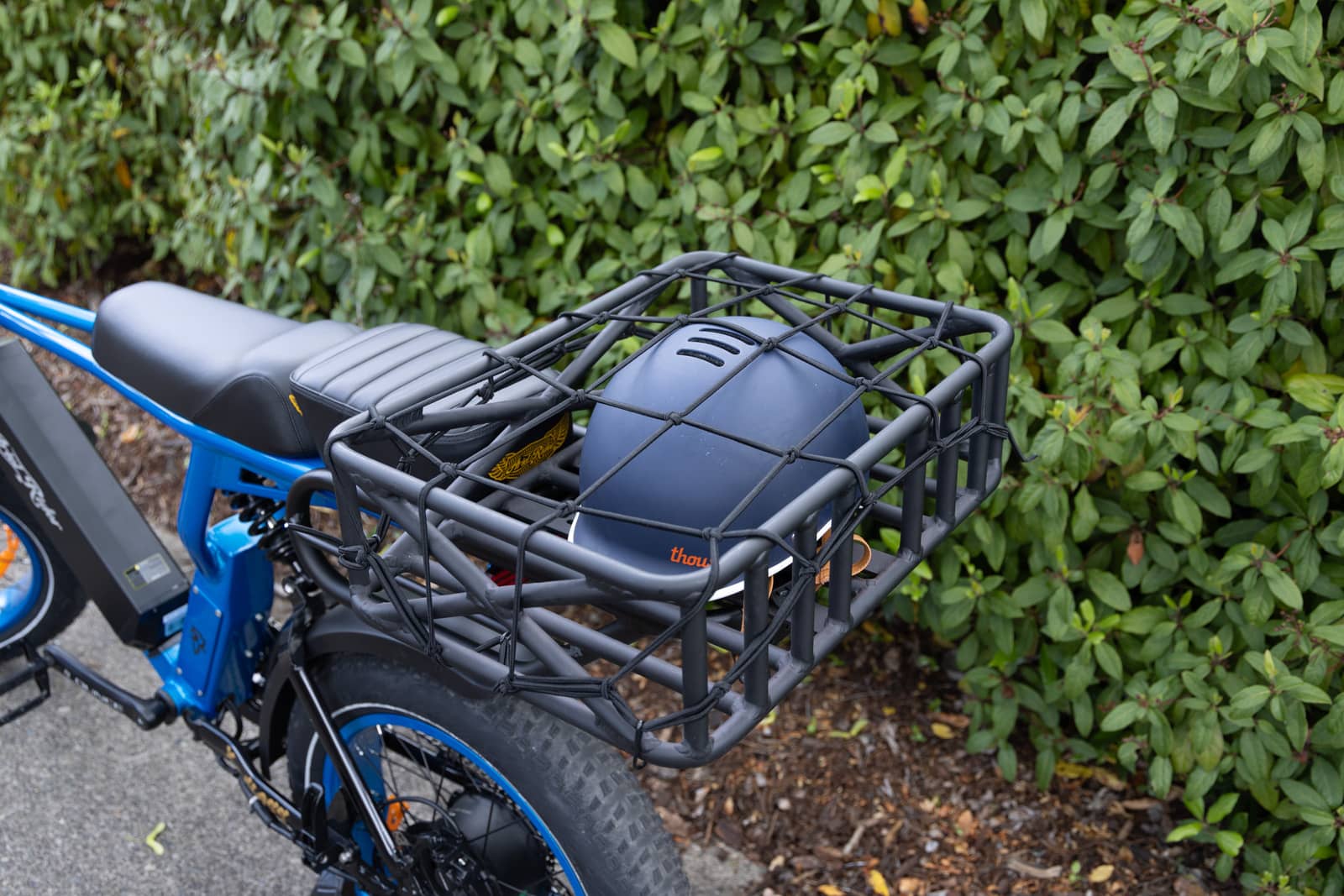 Cargo Basket with Helmet on E-Bike - Black Metal Basket with Net for Electric Bikes by Ariel Rider, Ideal for Carrying Items