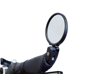 Ariel Rider ebike rearview mirror set installed on handlebars, enhancing rider safety and visibility.