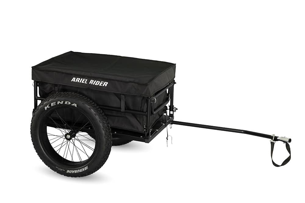 Ariel Rider electric bike cargo trailer with closed black cover, angled side view.