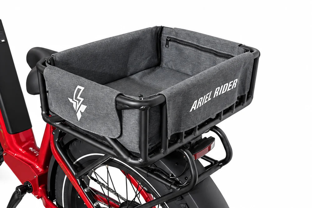 Rear three-quarter view of the Ariel Rider cargo basket and gray liner, with the interior zippered pocket visible.