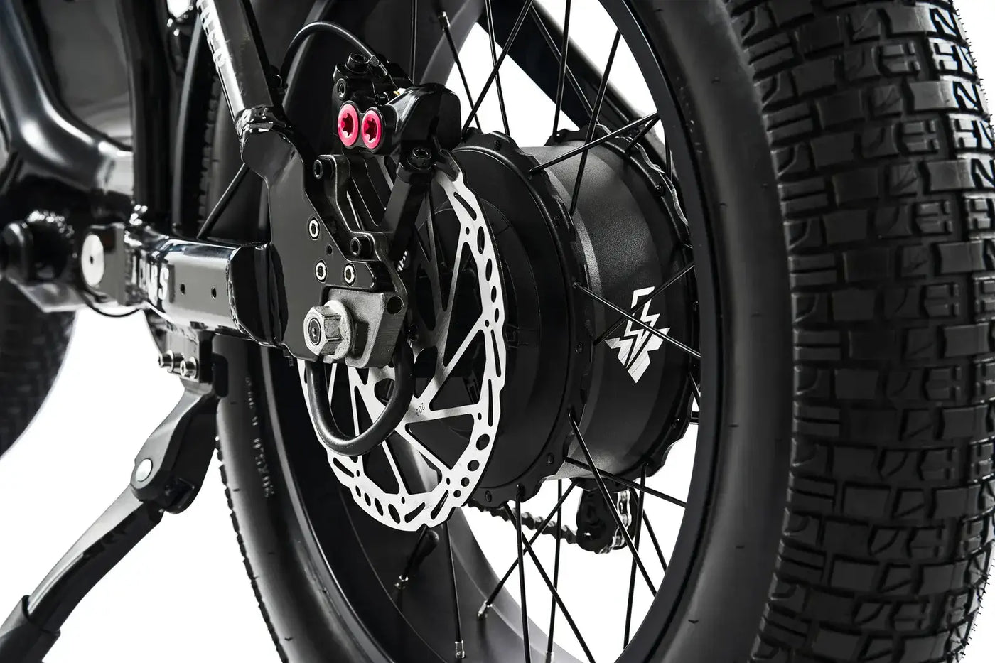 Rear wheel and chain drive assembly of the Ariel Rider X-Class 60V e-bike for maximum acceleration.