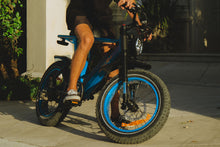 Load image into Gallery viewer, A man riding the X-Class 52V Ebike in blue