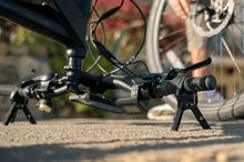 Load image into Gallery viewer, Compact Handlebar Jack folded and stored in a bike bag, showcasing its lightweight and easy-to-carry design for cyclists.