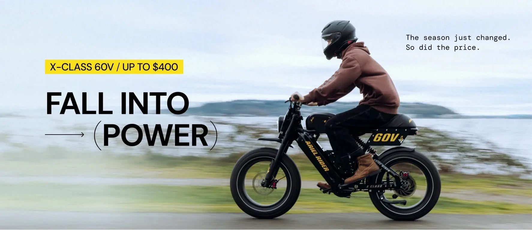 Ariel Rider X-Class 60V fall 2025 sale banner with rider in brown hoodie by the water, promoting up to $400 off.