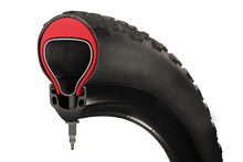 Load image into Gallery viewer, Step-by-step installation of Tannus Armour Inserts into a bicycle tire, demonstrating the simple process for riders.